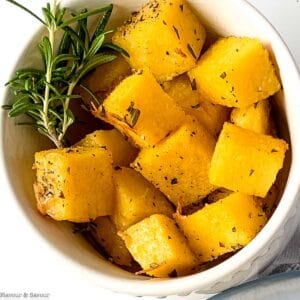 Close up view of herbed polenta croutons with rosemary.