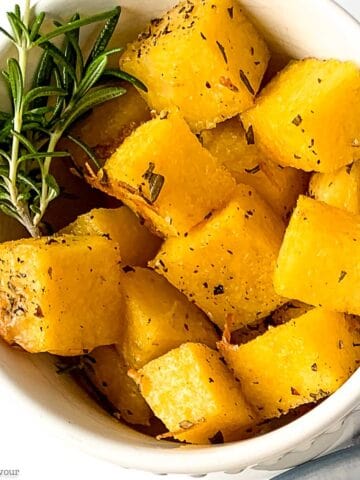 Close up view of herbed polenta croutons with rosemary.