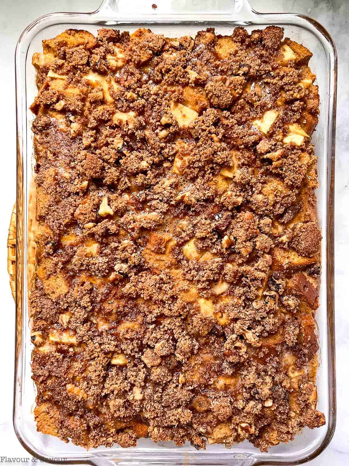 Gluten-free Apple Cinnamon French Toast casserole with streusel topping in a baking pan.