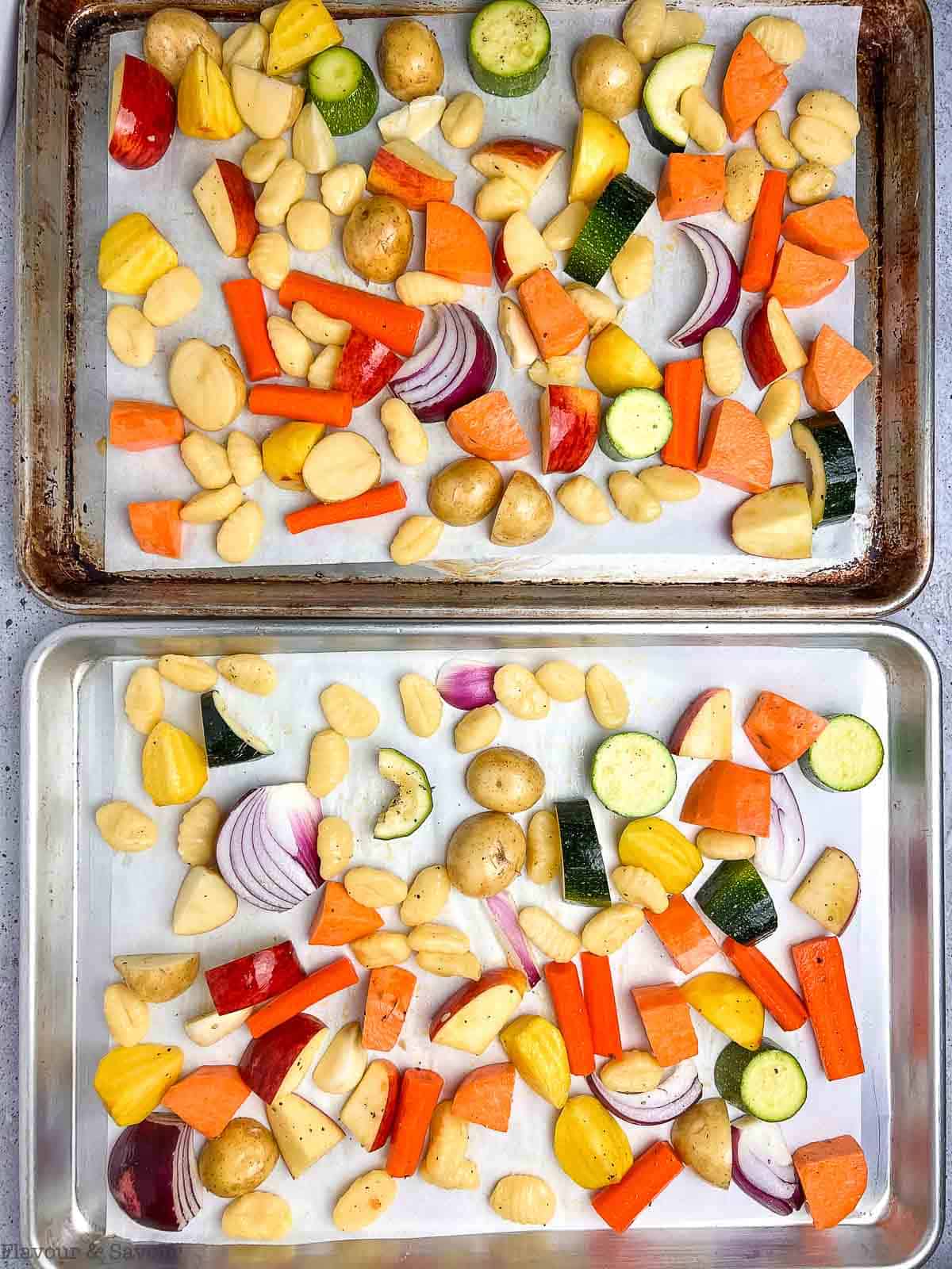 Roasted gnocchi and fall vegetables on two sheet pans.