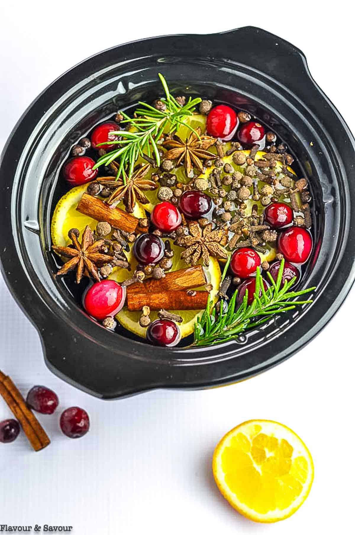 Simmering holiday potpourri mix in a mini slow cooker.