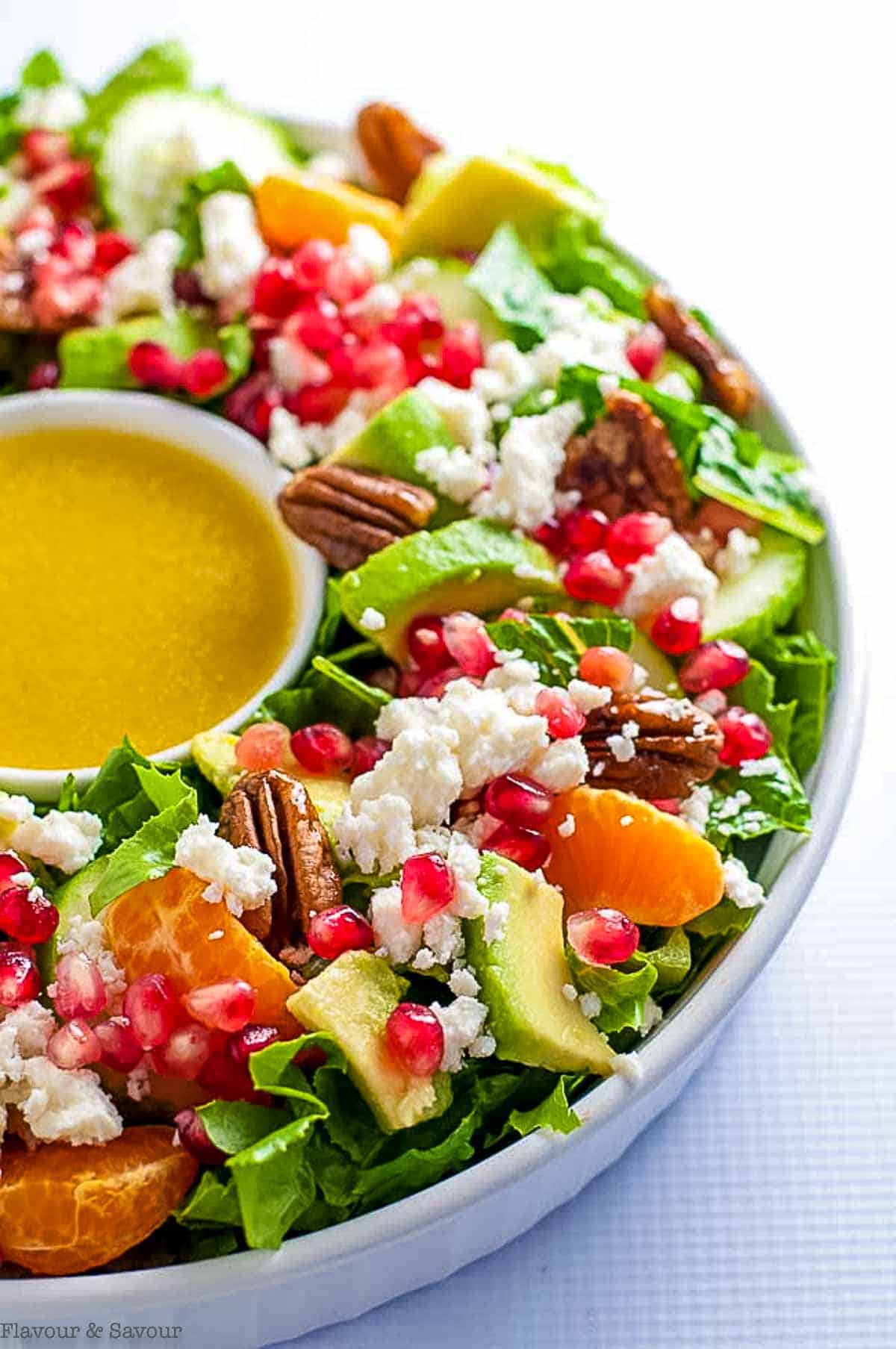 Christmas Wreath Salad with pomegranate, mandarin oranges, avocado and feta cheese.