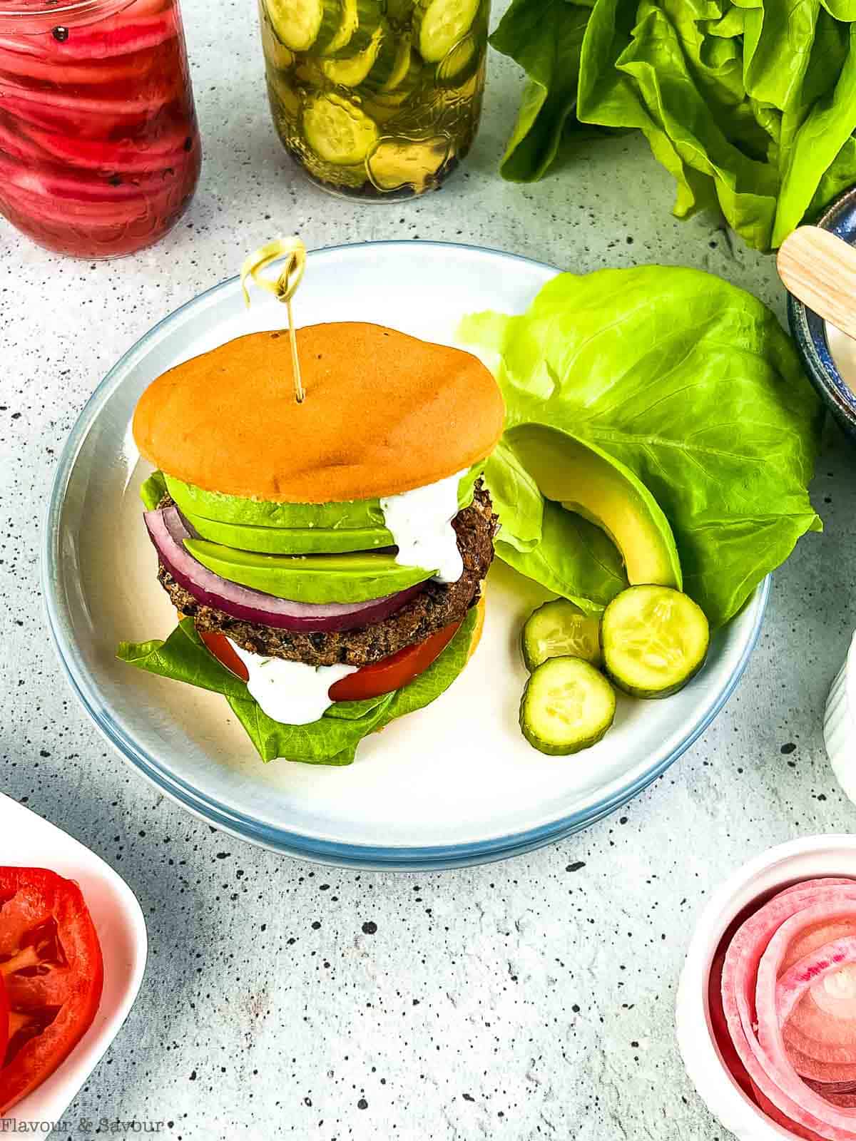 A mushroom black bean burger with condiments.