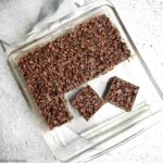 Chocolate Peanut Butter Rice Krispie squares in a glass baking pan.