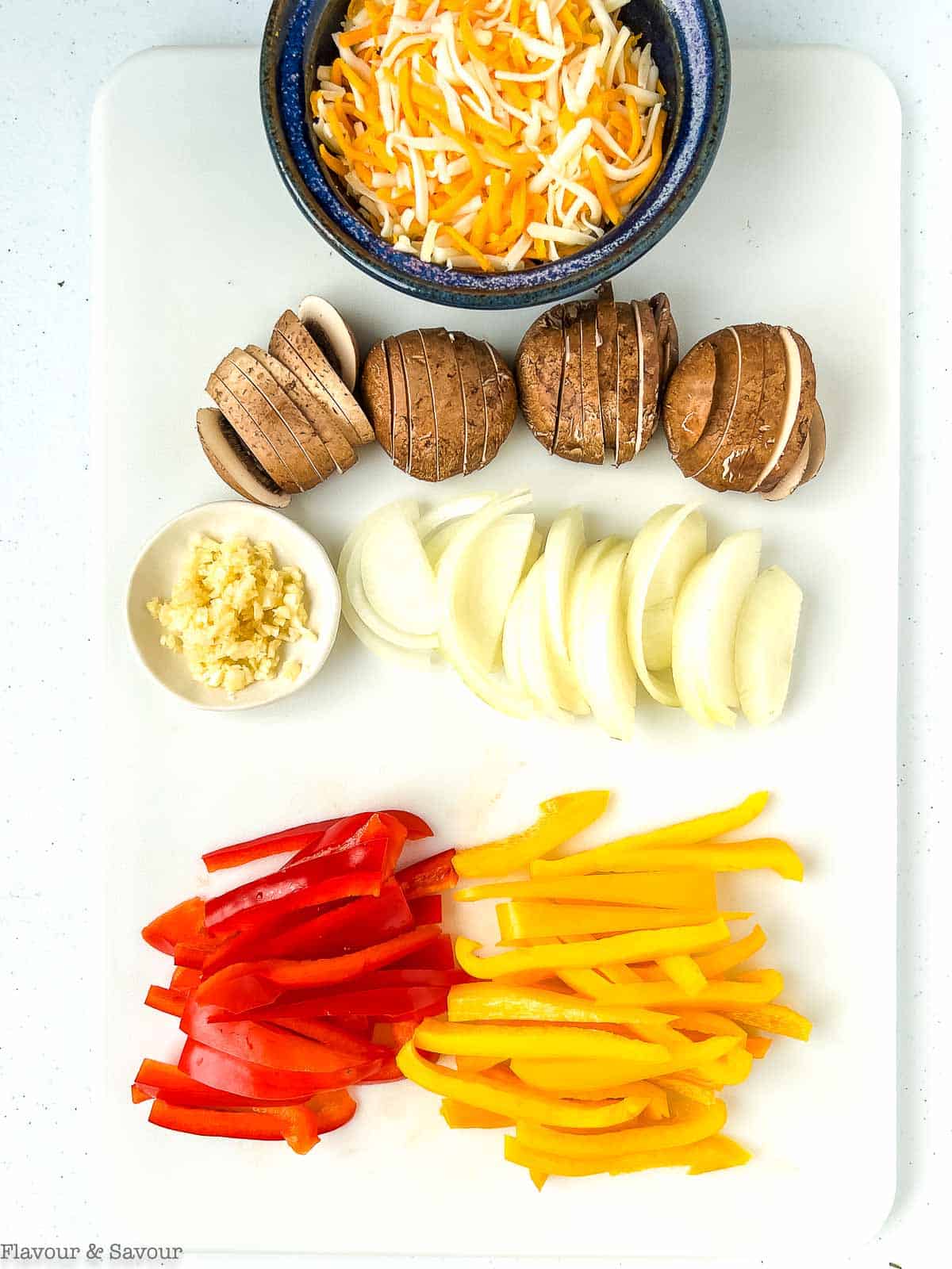 Prepared vegetables and aromatics for baked fajita chicken casserole.