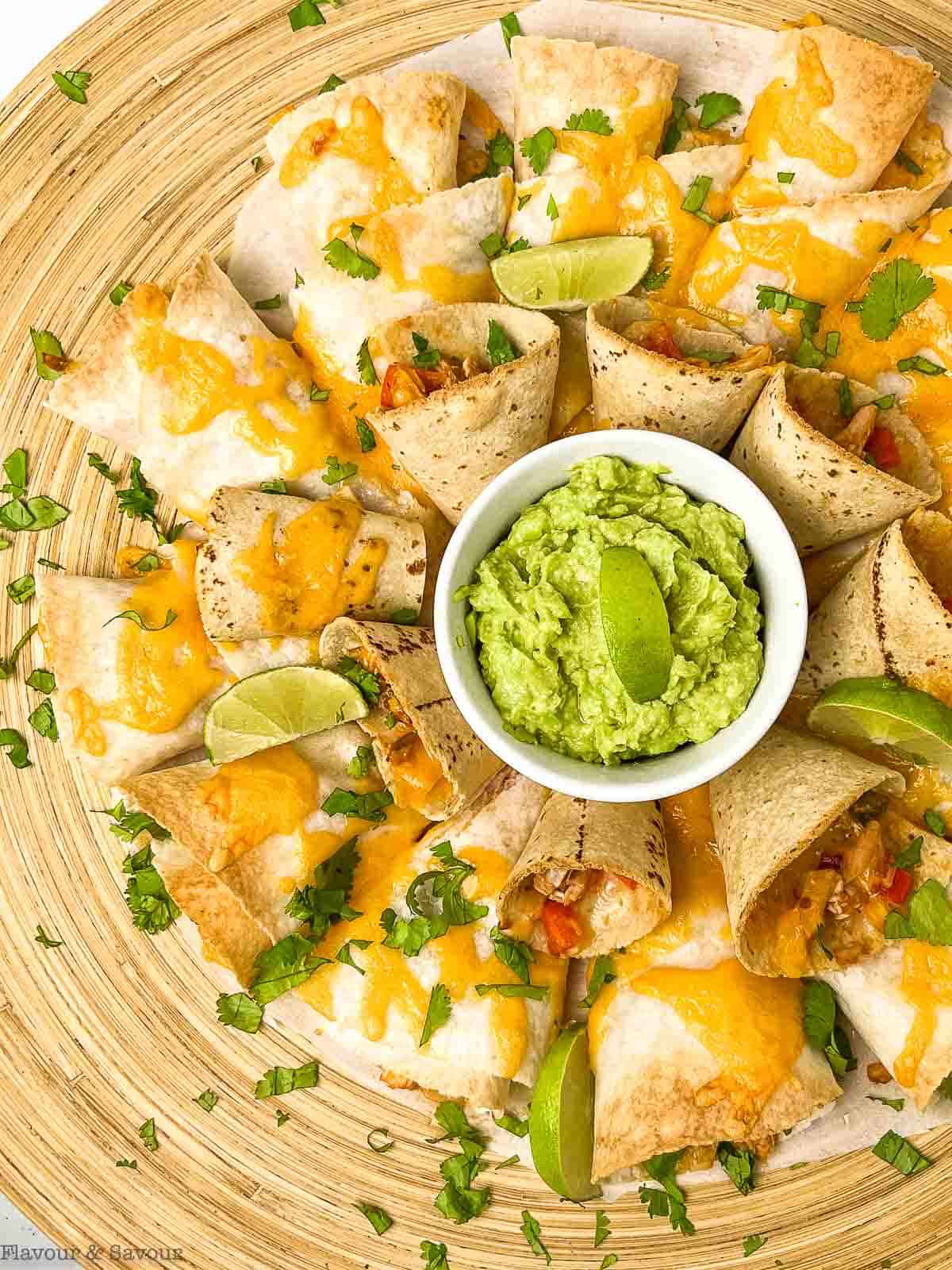 Overhead view of a quesadilla party platter with guacamole.