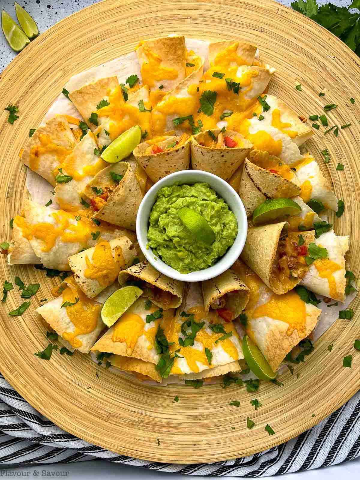 Overhead view of a gluten-free blooming quesadilla ring platter with guacamole.