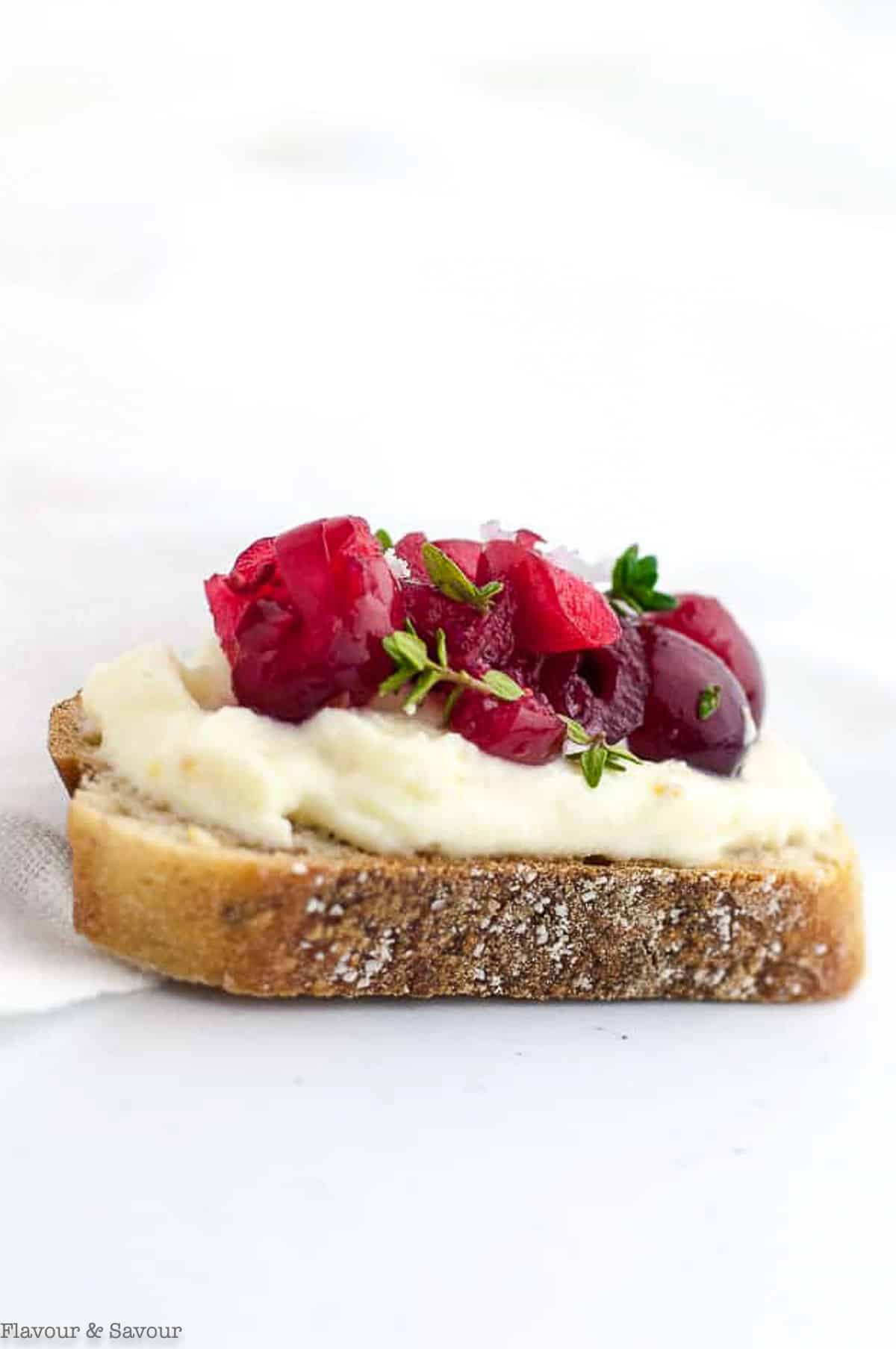 A cranberry ricotta crostini appetizer.