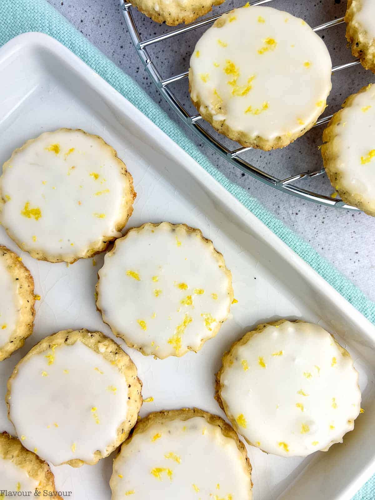 Overhead view of a plate of almond flour early gray shortbread with lemon glaze.