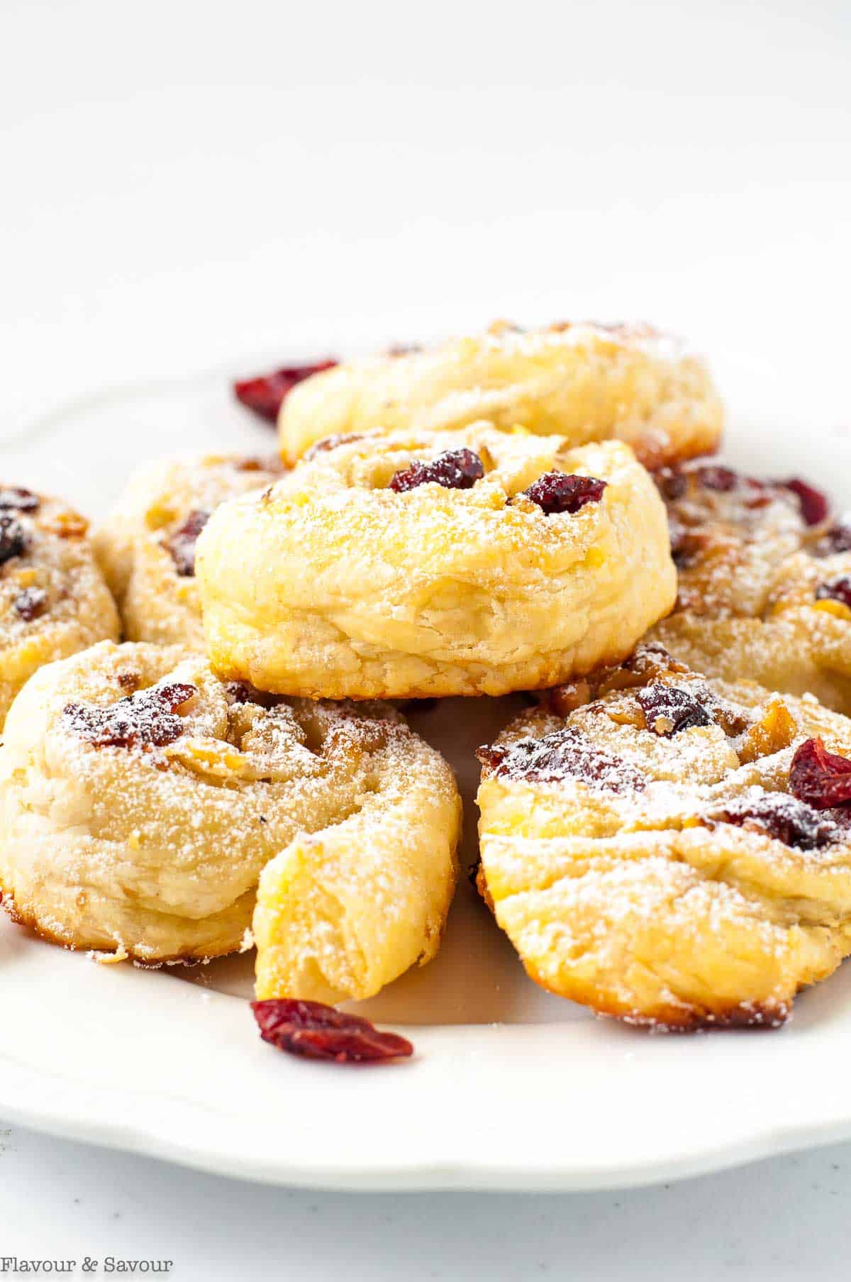 Cranberry Brie puff pastry bites on a plate.