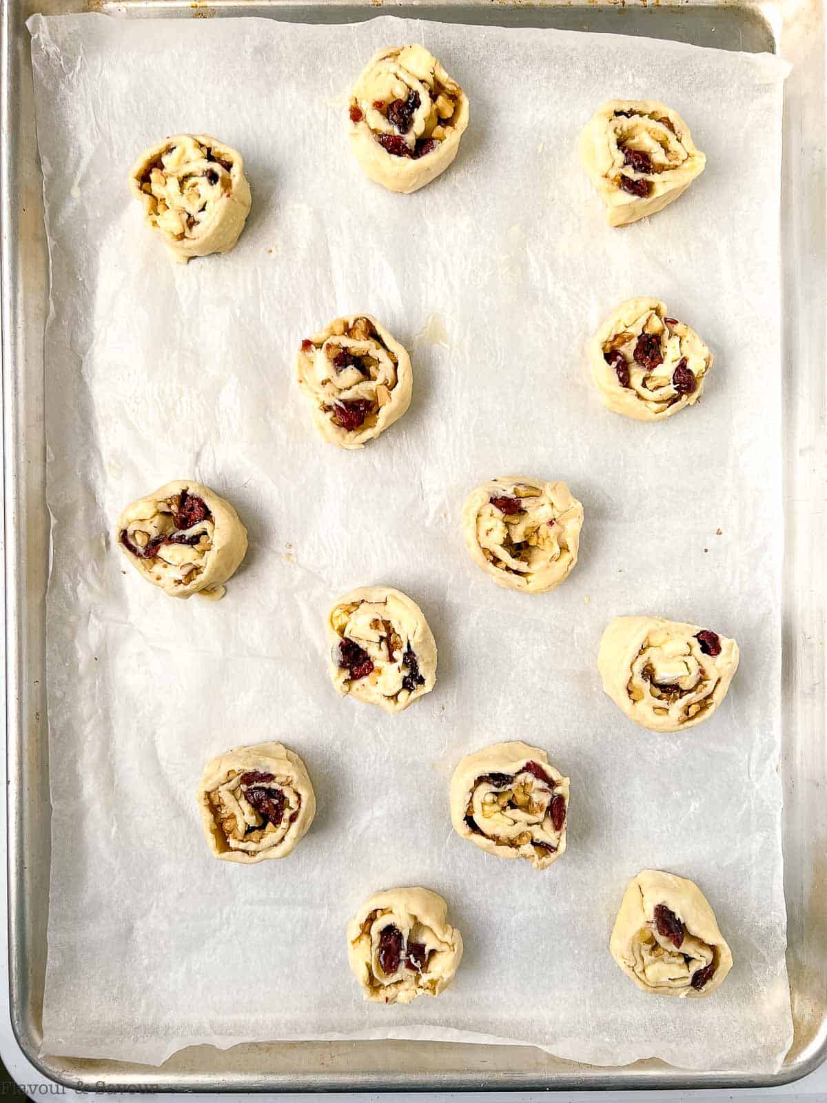 Puff pastry cranberry Brie pinwheels ready to bake.