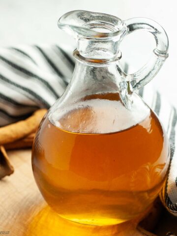 Cinnamon simple syrup in a cruet.