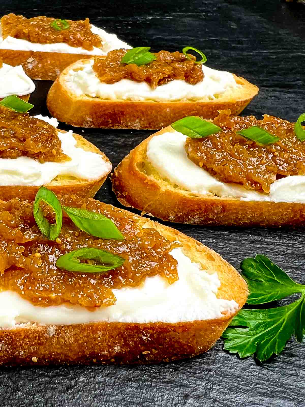 Close up view of fig and goat cheese crostini.