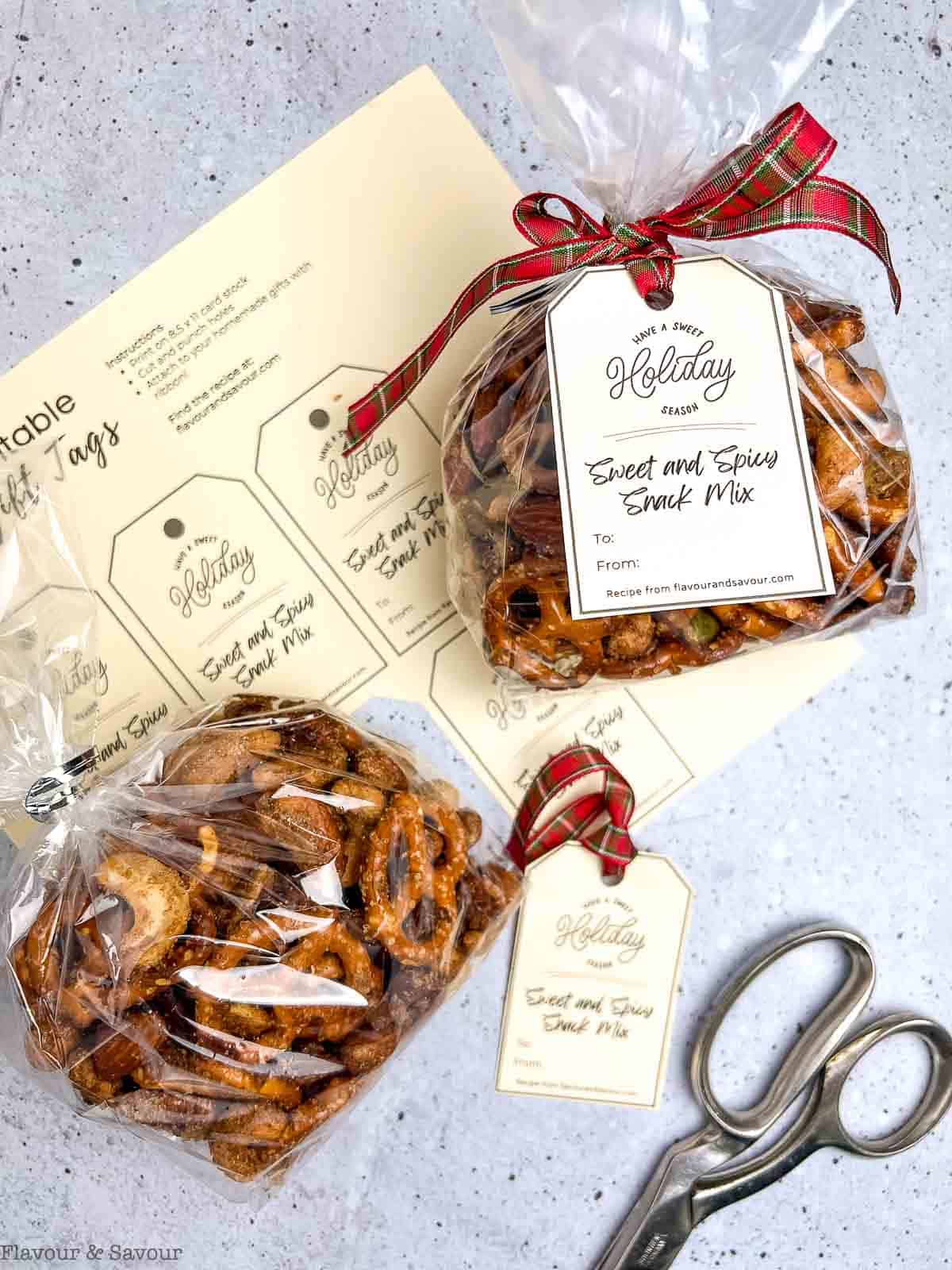 Pretzel and Nut Snack Mix in cellophane bags with gift tags and a ribbon.
