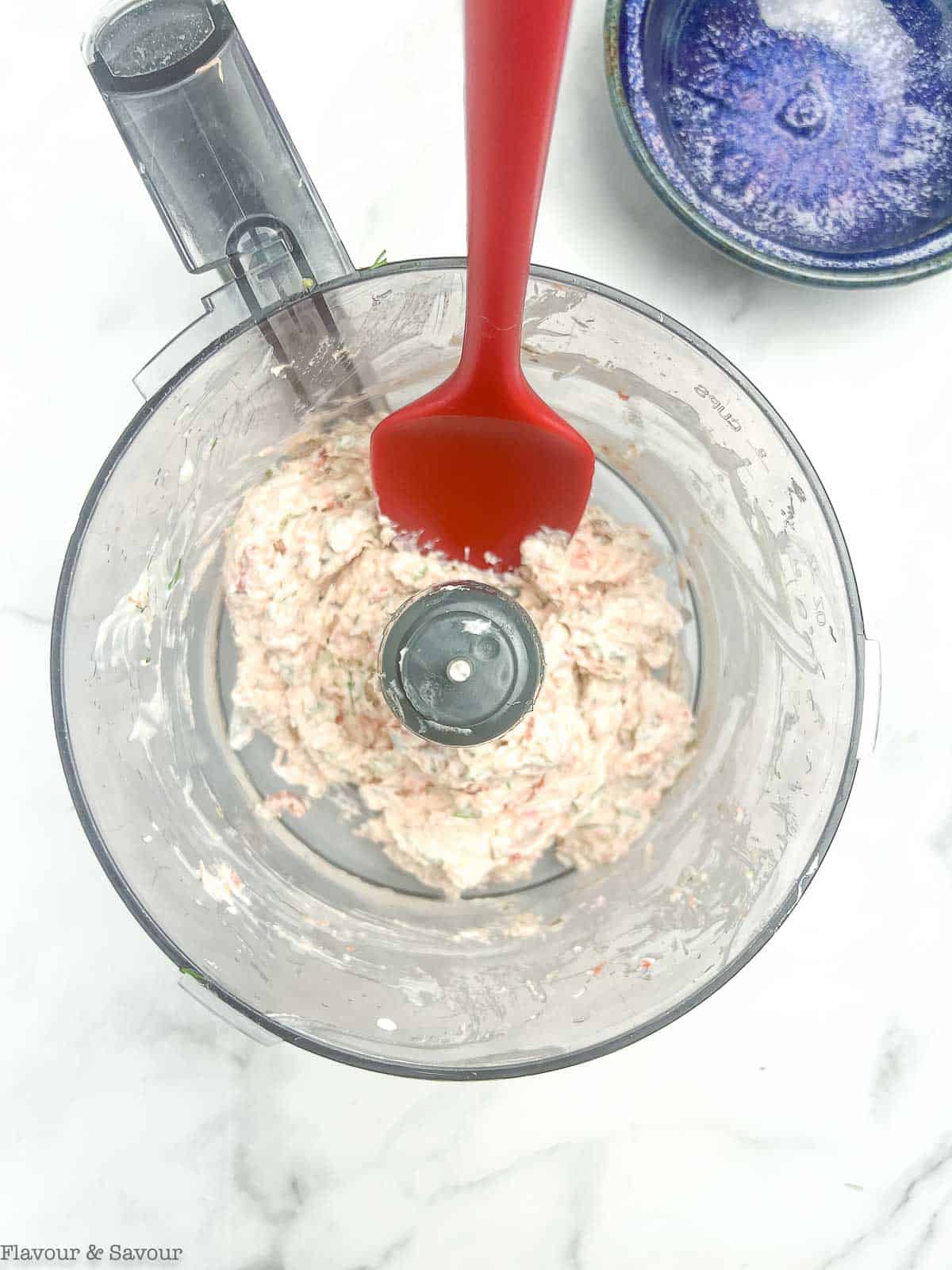 Smoked Salmon Dip in a food processor bowl with a spatula.