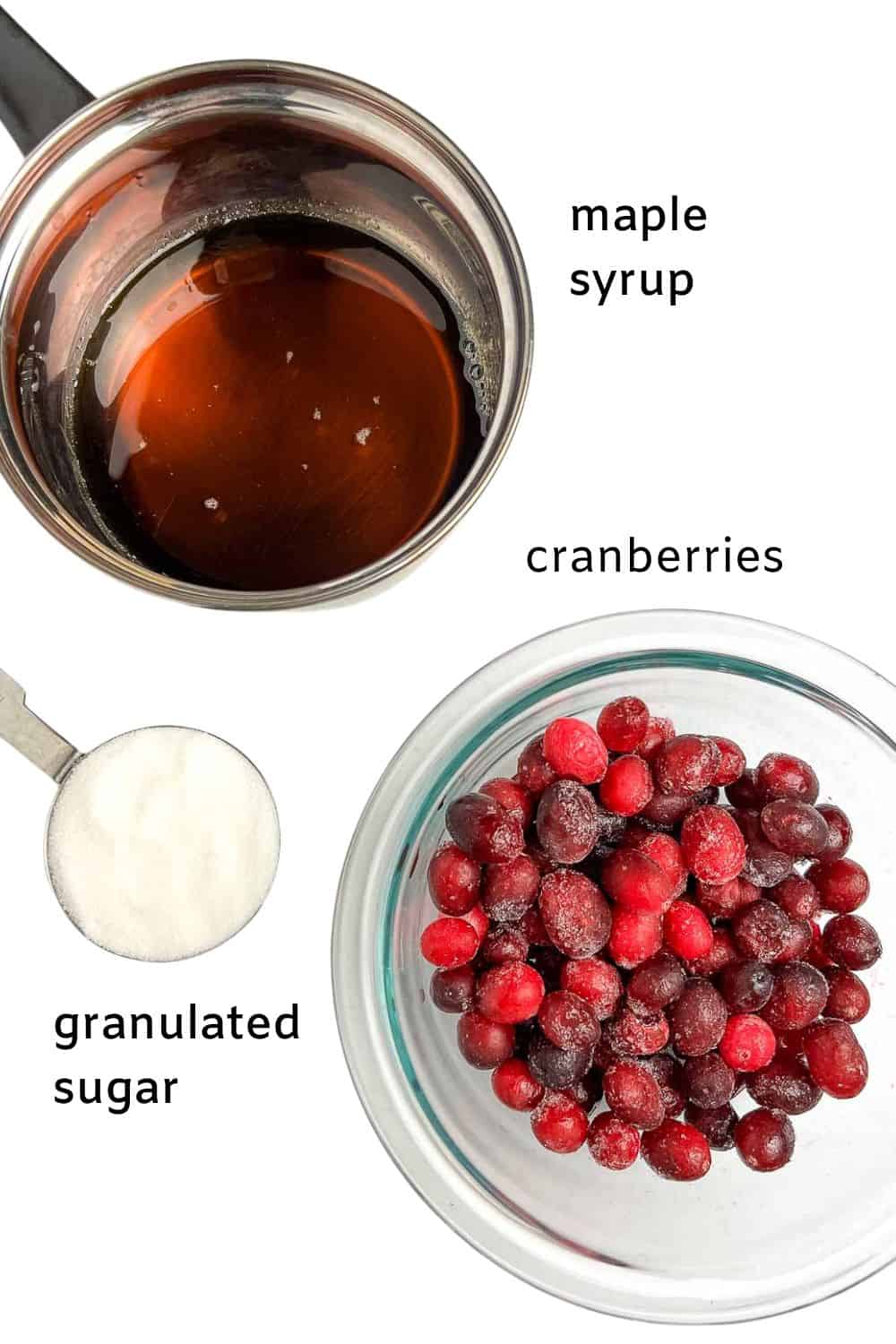 Ingredients for sugared cranberries, maple syrup, cranberries and granulated sugar.
