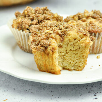 Banana Muffins with Streusel Topping on a plate.