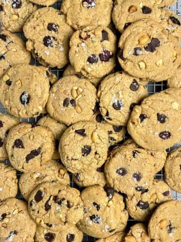 Gluten-free kitchen sink cookies on a wire cooling rack.