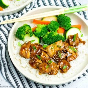 Overhead view of a Teriyaki Chicken Rice Bowl with vegetables.