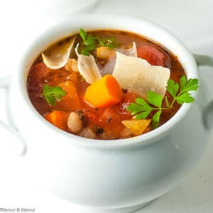 Close up view of a bowl of Slow Cooker Tuscan Minestrone Soup.