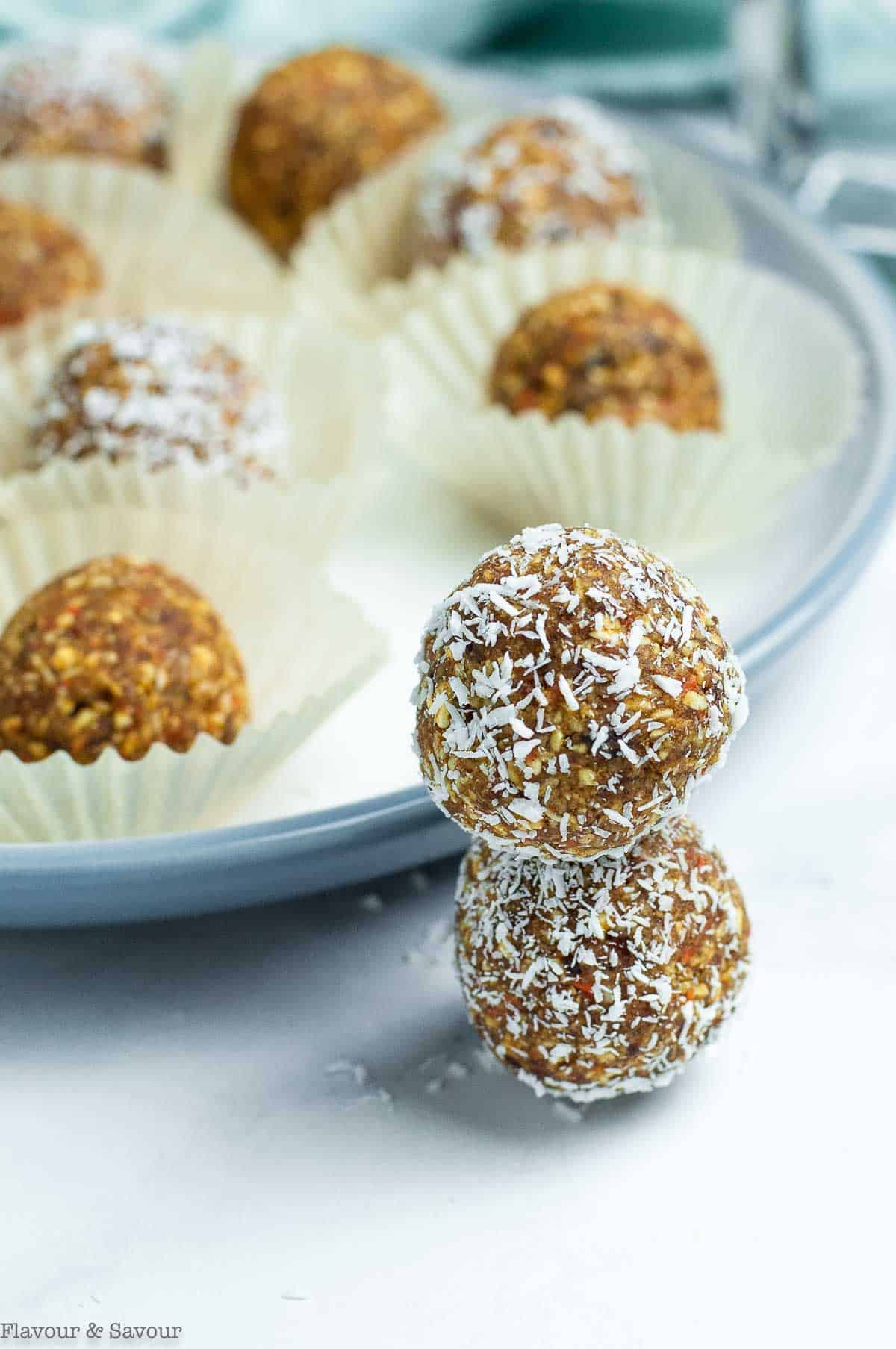 Two nut-free carrot energy balls, stacked.