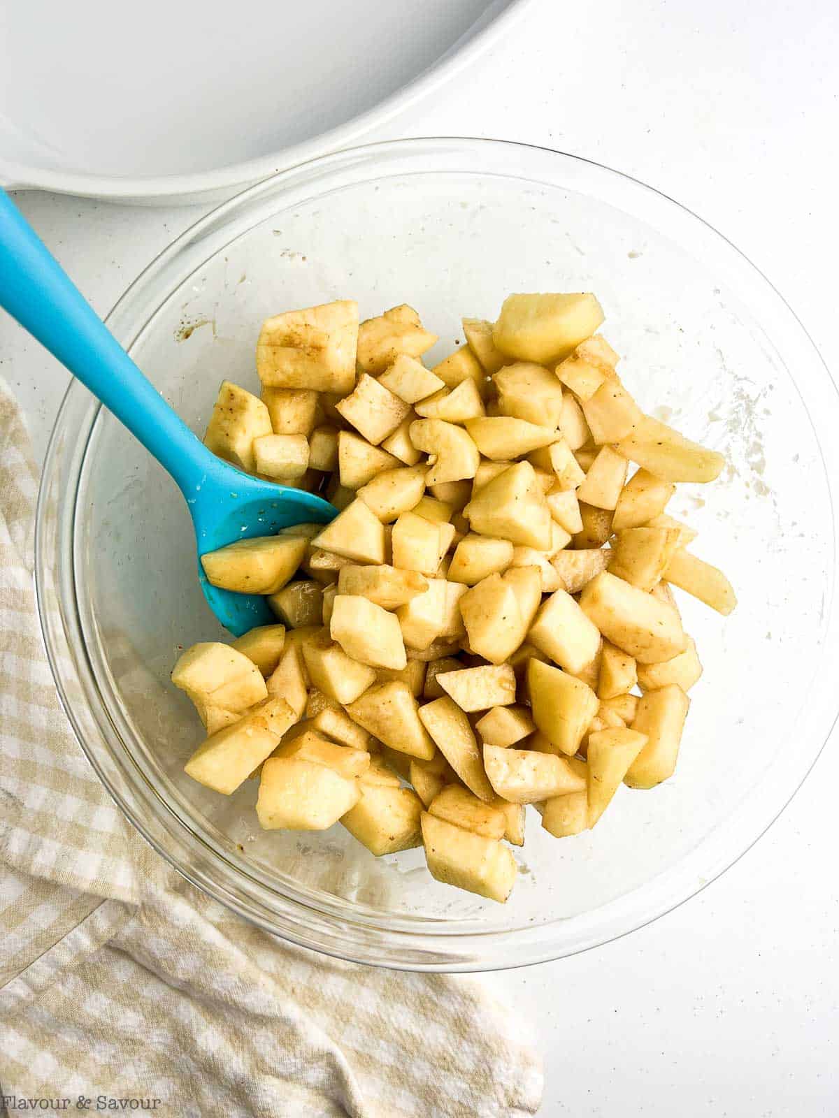 Chopped pears in a bowl for pecan pear crisp.