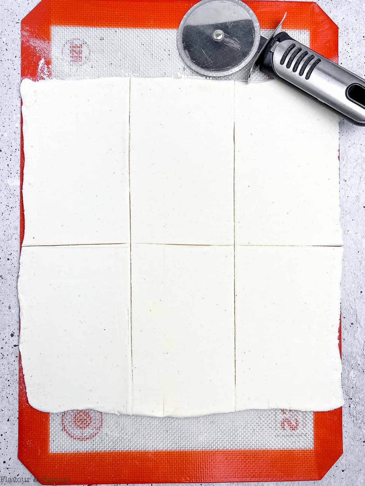 Puff pastry sliced to make hand pastry pies.