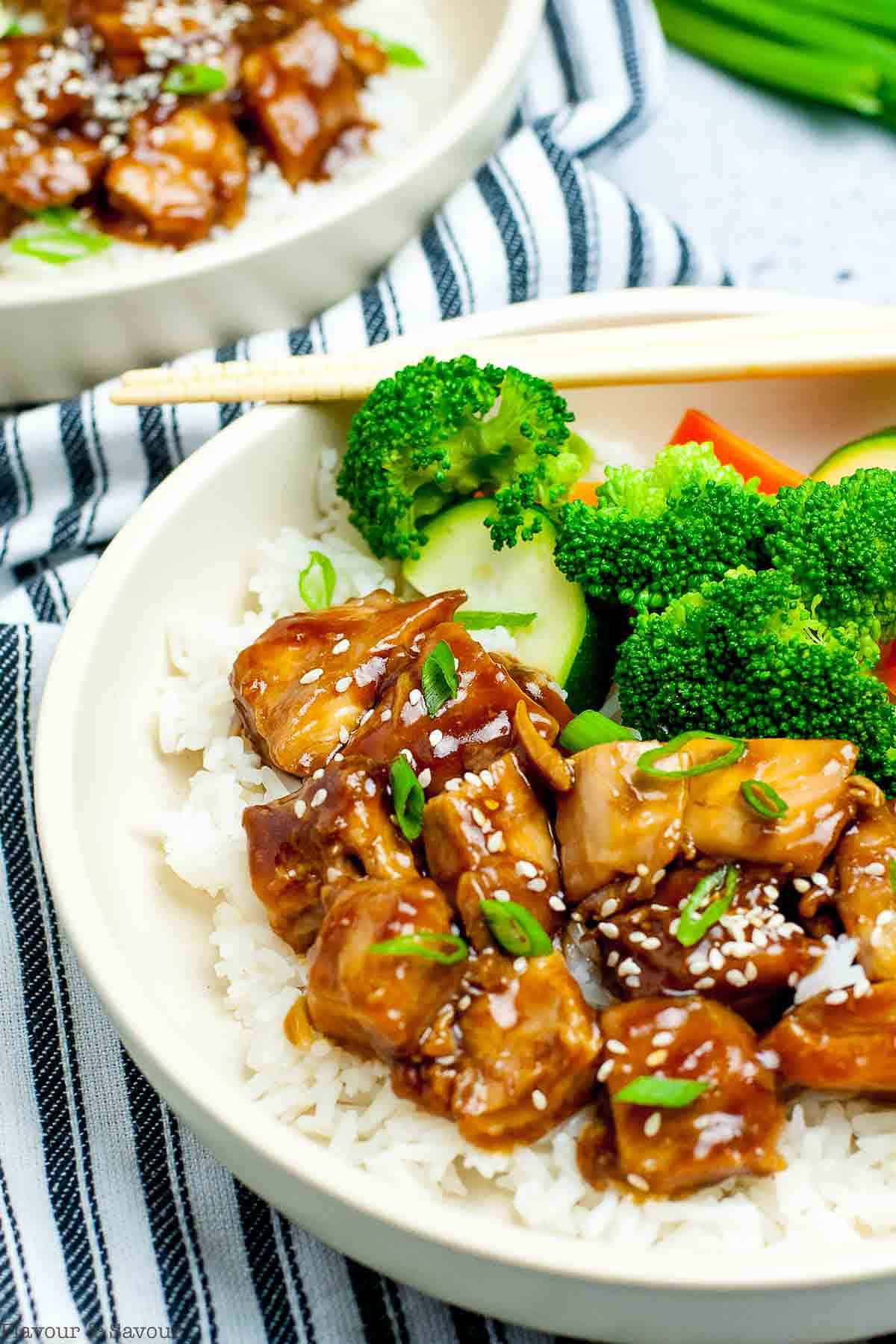 Teriyaki chicken rice bowls with broccoli, carrots and zucchini.