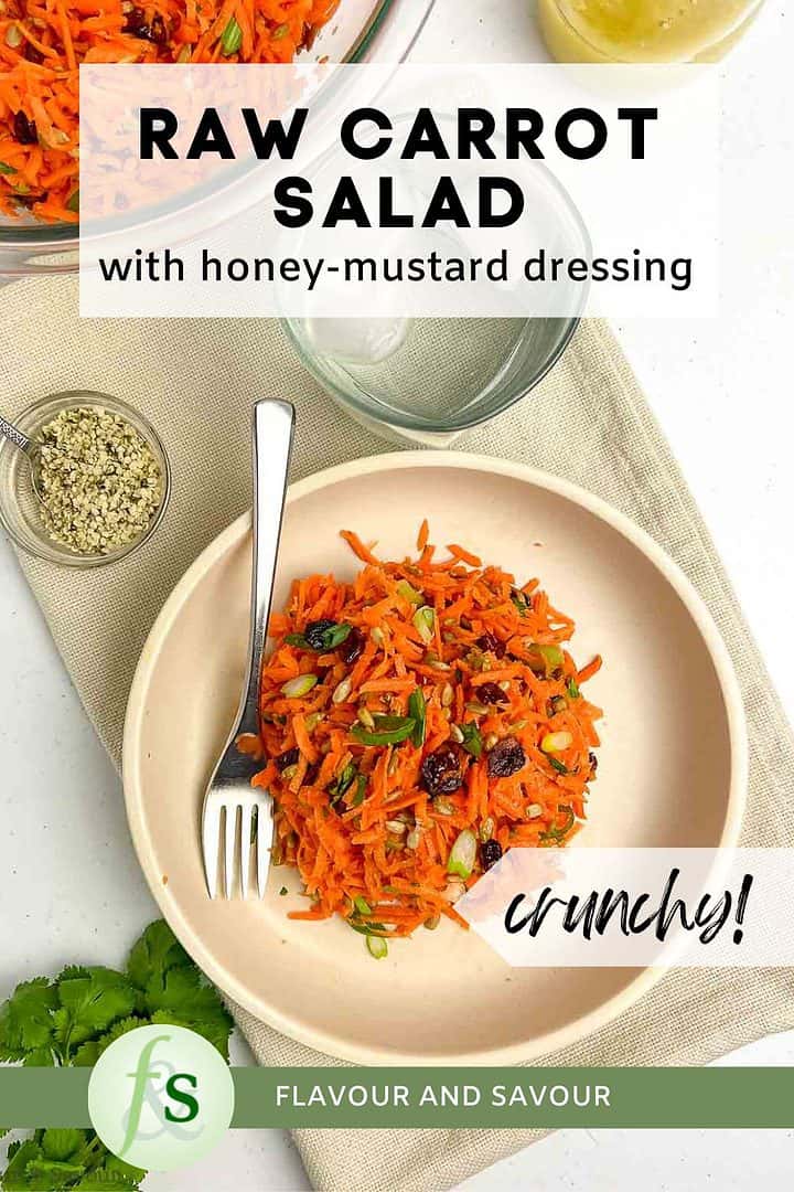 Image with text overly for raw carrot salad with honey-Dijon dressing.
