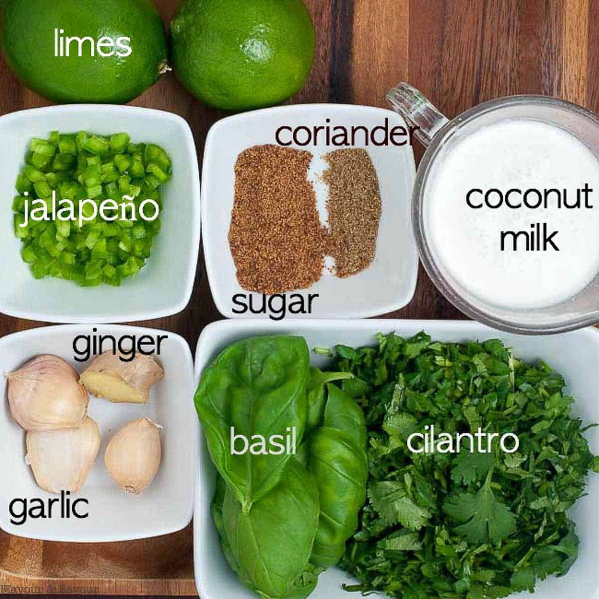 Labelled ingredients for Easy Thai Baked Chicken marinade: limes, jalapeño, coconut sugar, coriander, coconut milk, ginger, garlic, basil and cilantro.