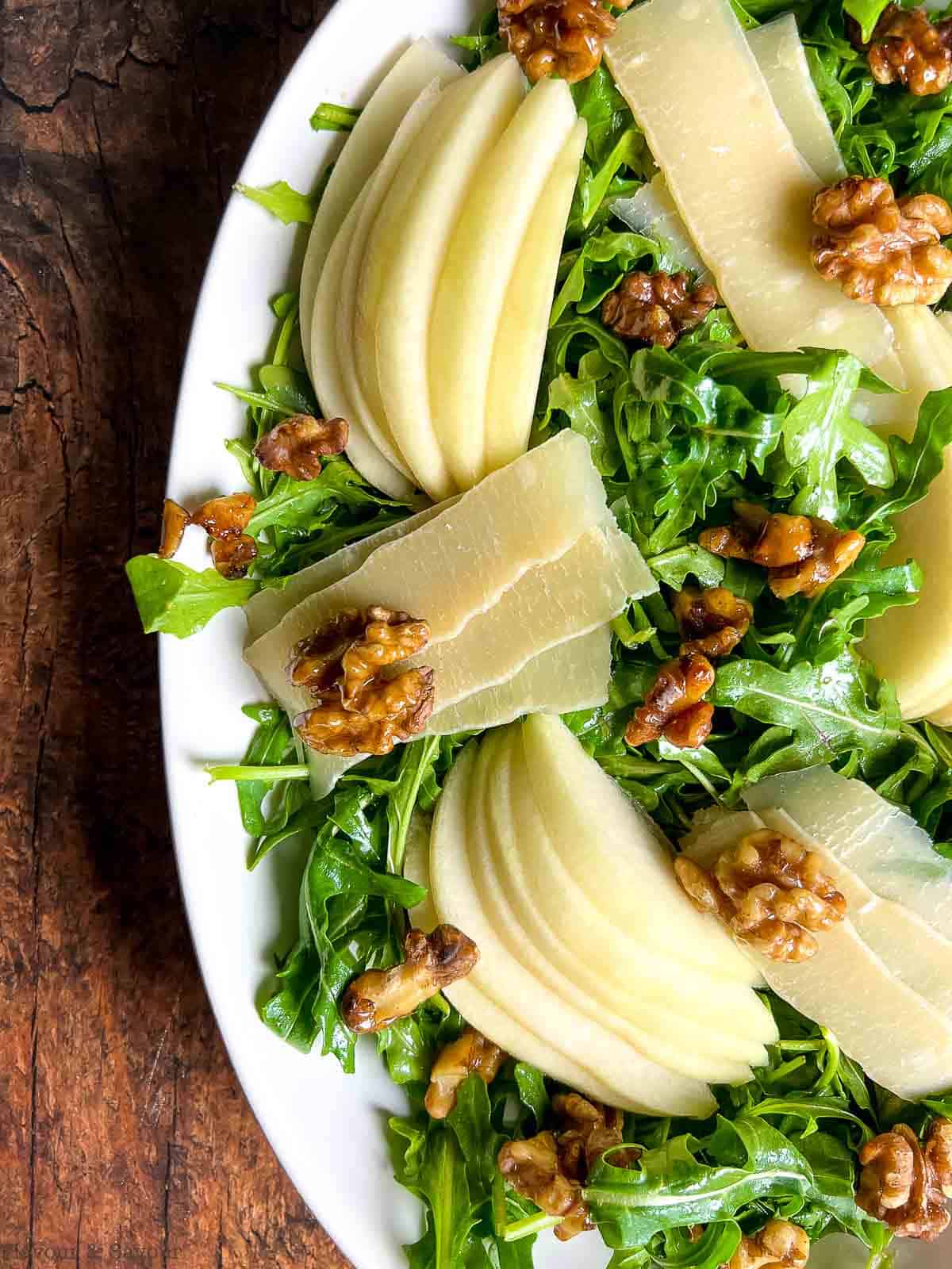 Close up view of arugula and pear salad.