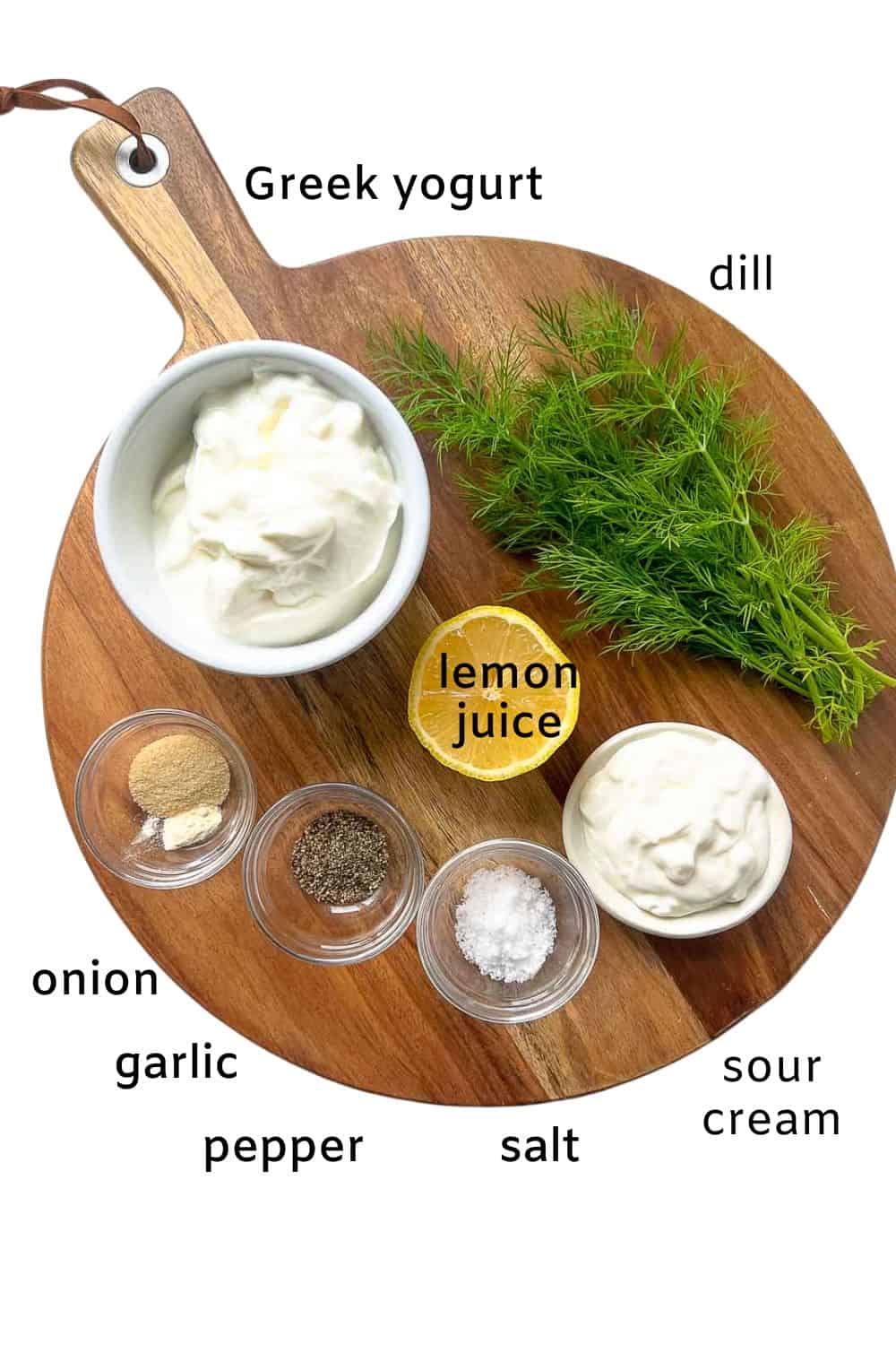 Labelled ingredients for Greek yogurt dill dip: Greek yogurt, dill, lemon juice, sour cream, onion and garlic powder, salt and pepper.