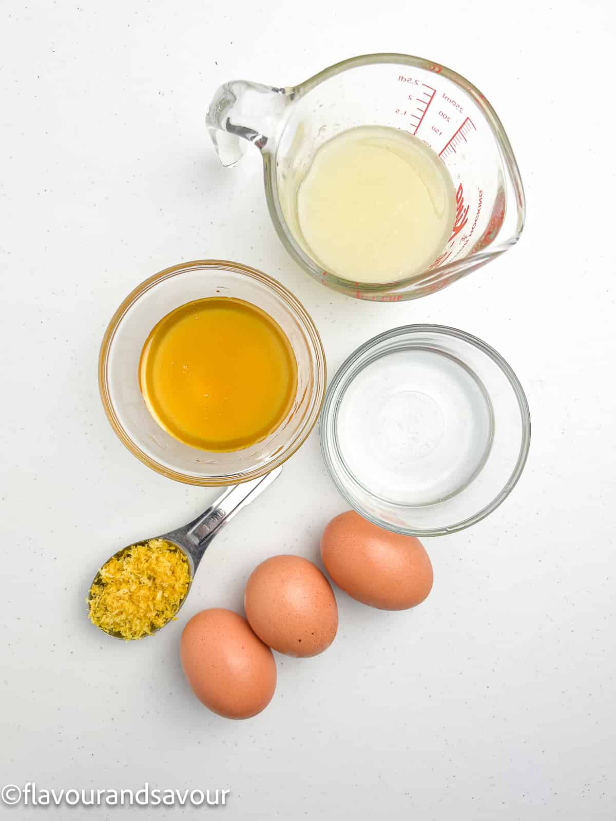 Ingredients for paleo lemon curd: lemon zest and juice, honey, coconut oil, and eggs.