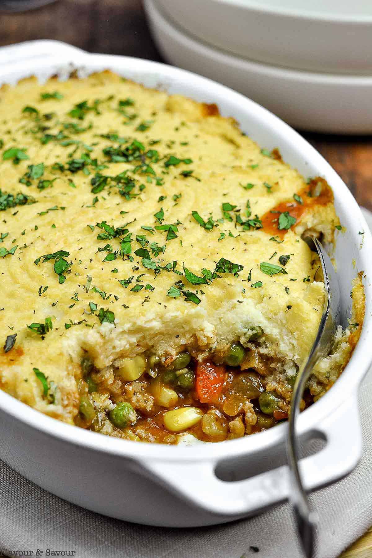 Close up view of a baking dish of Shepherd's pie with cauliflower crust.