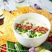 Bacon and Chive Jalapeño Dip surrounded by fresh veggies.