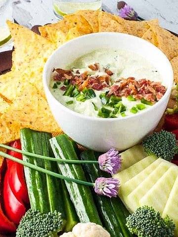 Bacon and Chive Jalapeño Dip surrounded by fresh veggies.
