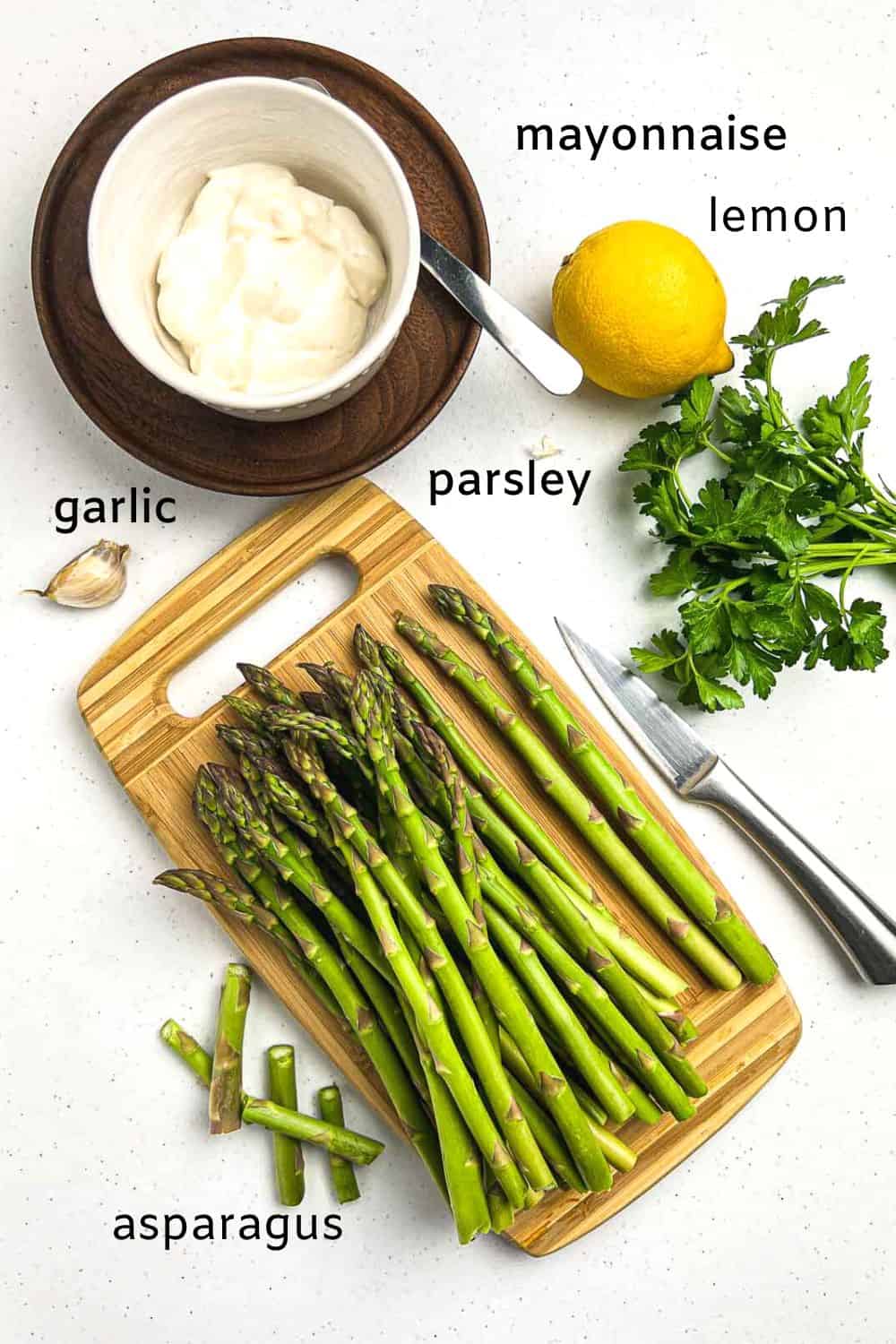 Ingredients with labels for asparagus with lemon garlic aioli: asparagus, mayonnaise, lemon, parsley, garlic, sea salt.