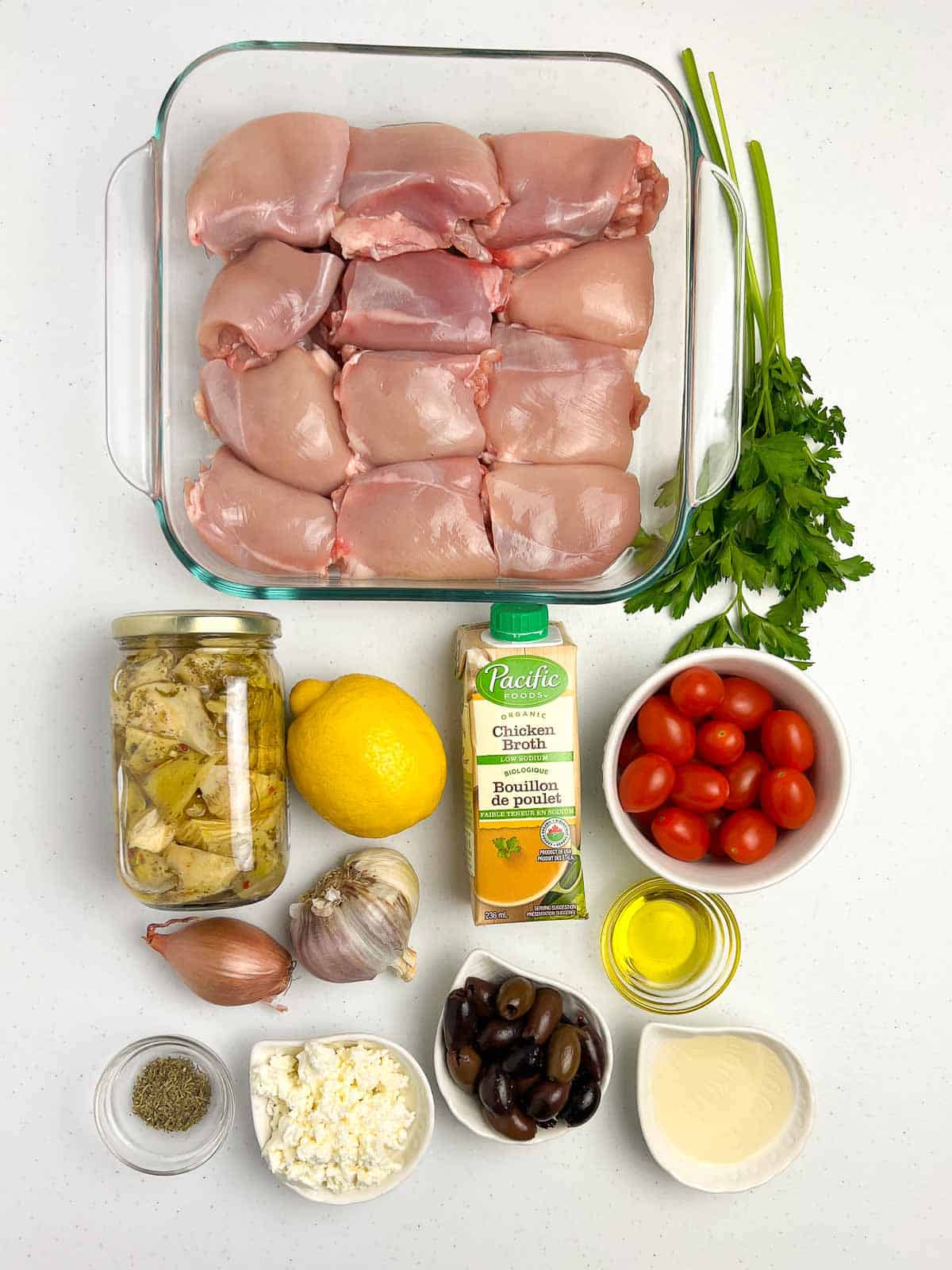 Ingredients for bake lemon artichoke chicken with olives and feta cheese.
