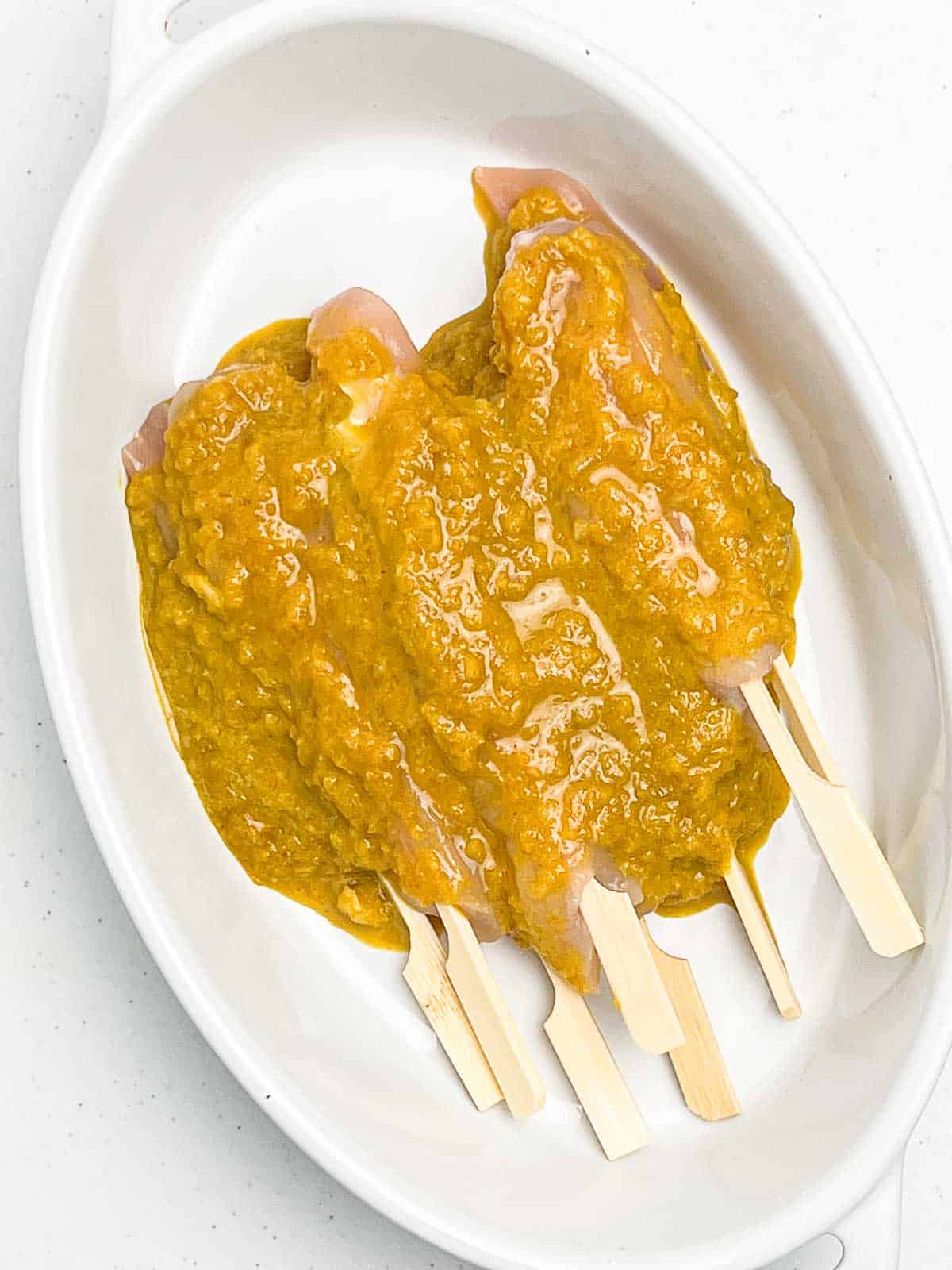 Chicken skewers with satay marinade.