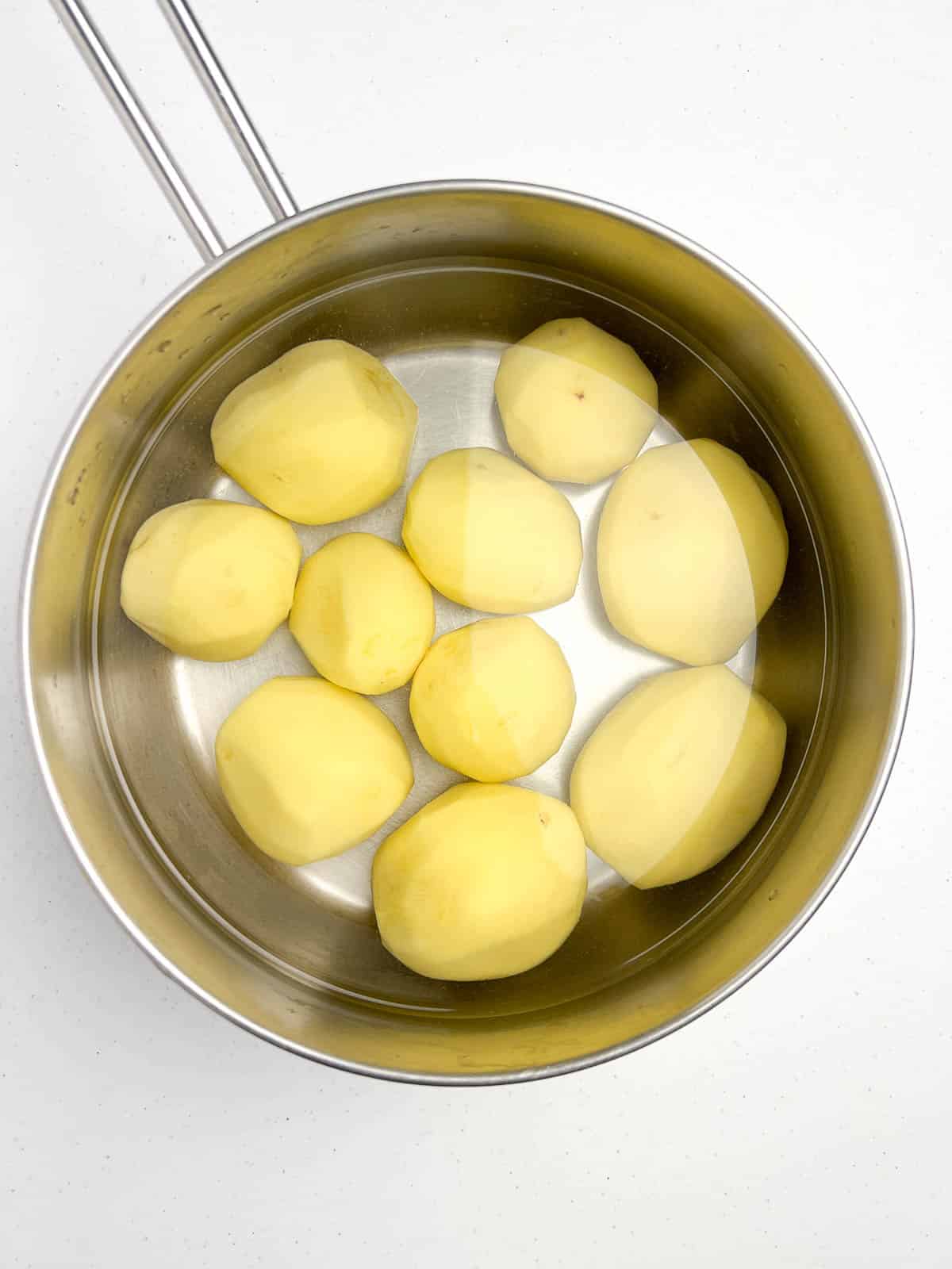 Potatoes in a pot ready to boil for Spanish tortilla.