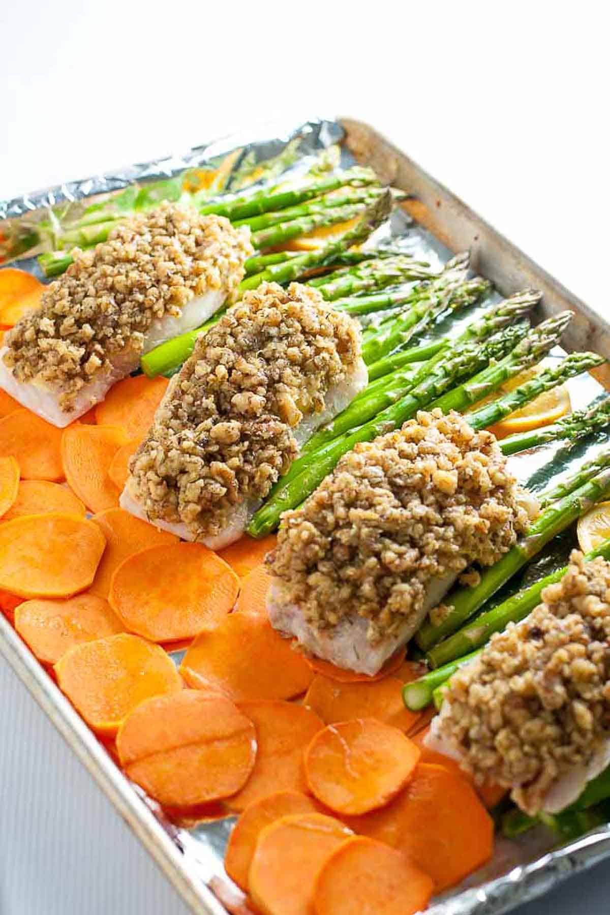 Maple Walnut Crusted Sheet Pan Halibut with crispy sweet potato chips and roasted asparagus spears