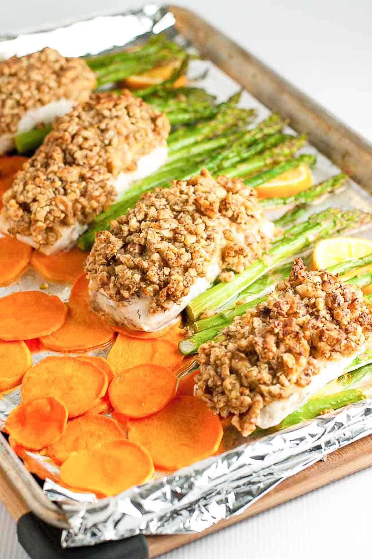 Maple Walnut Crusted Sheet Pan Halibut with sweet potatoes and asparagus.
