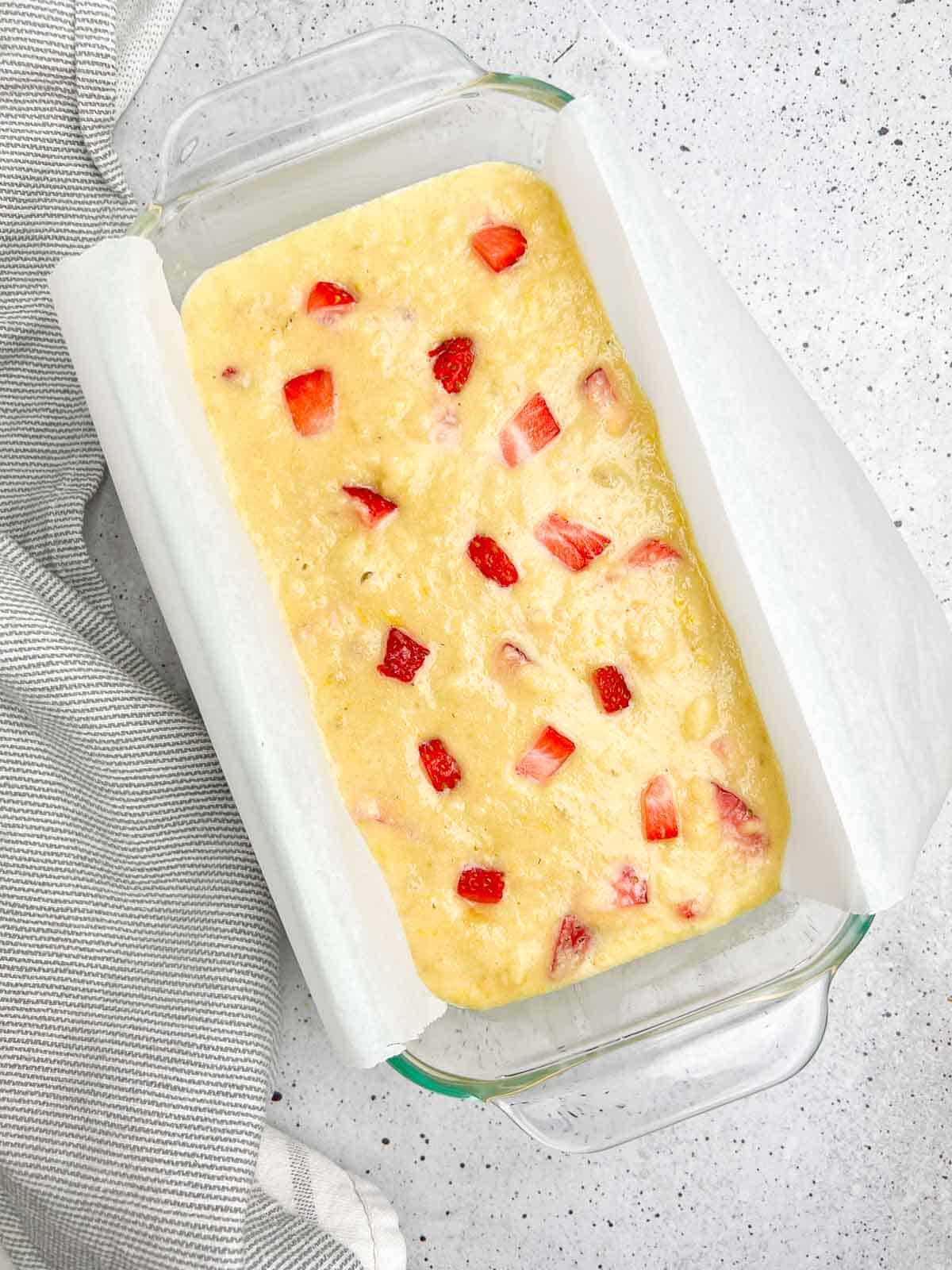 Gluten-free almond flour strawberry banana bread in a loaf pan ready to bake.