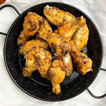 Air Fryer Hot Honey Wings in a dark serving dish.