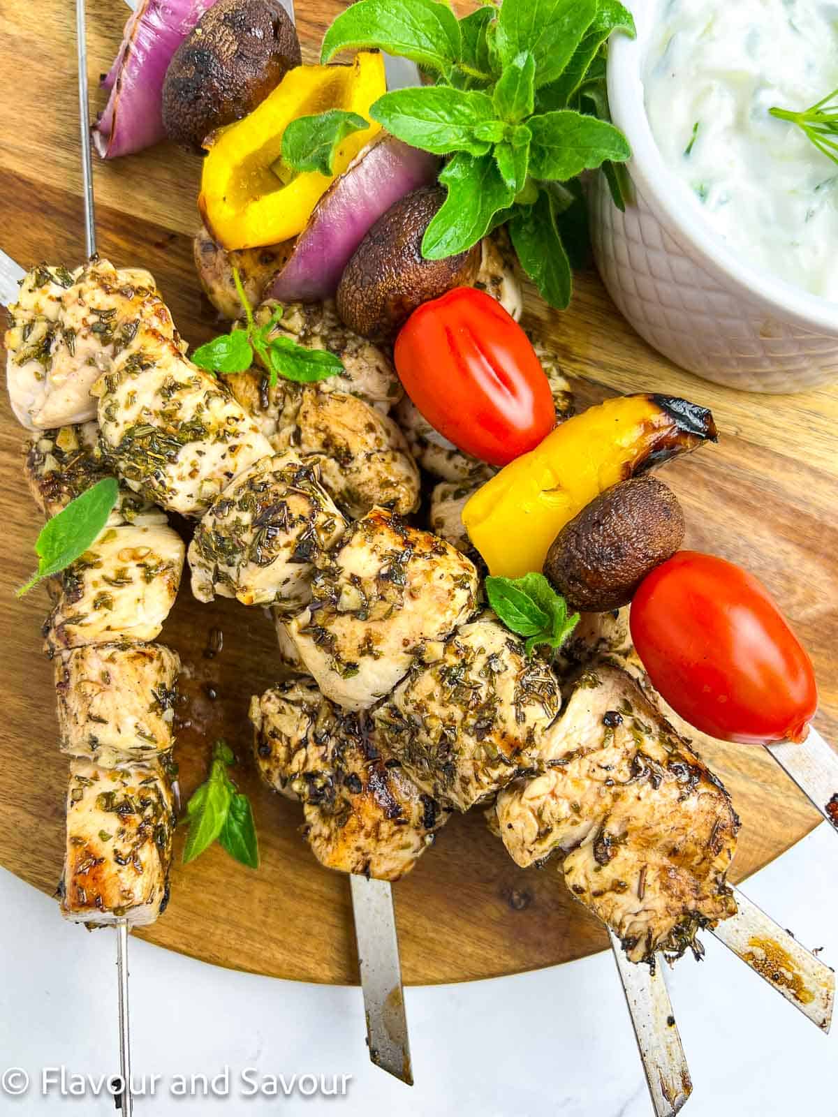 Chicken skewers with skewered vegetables.