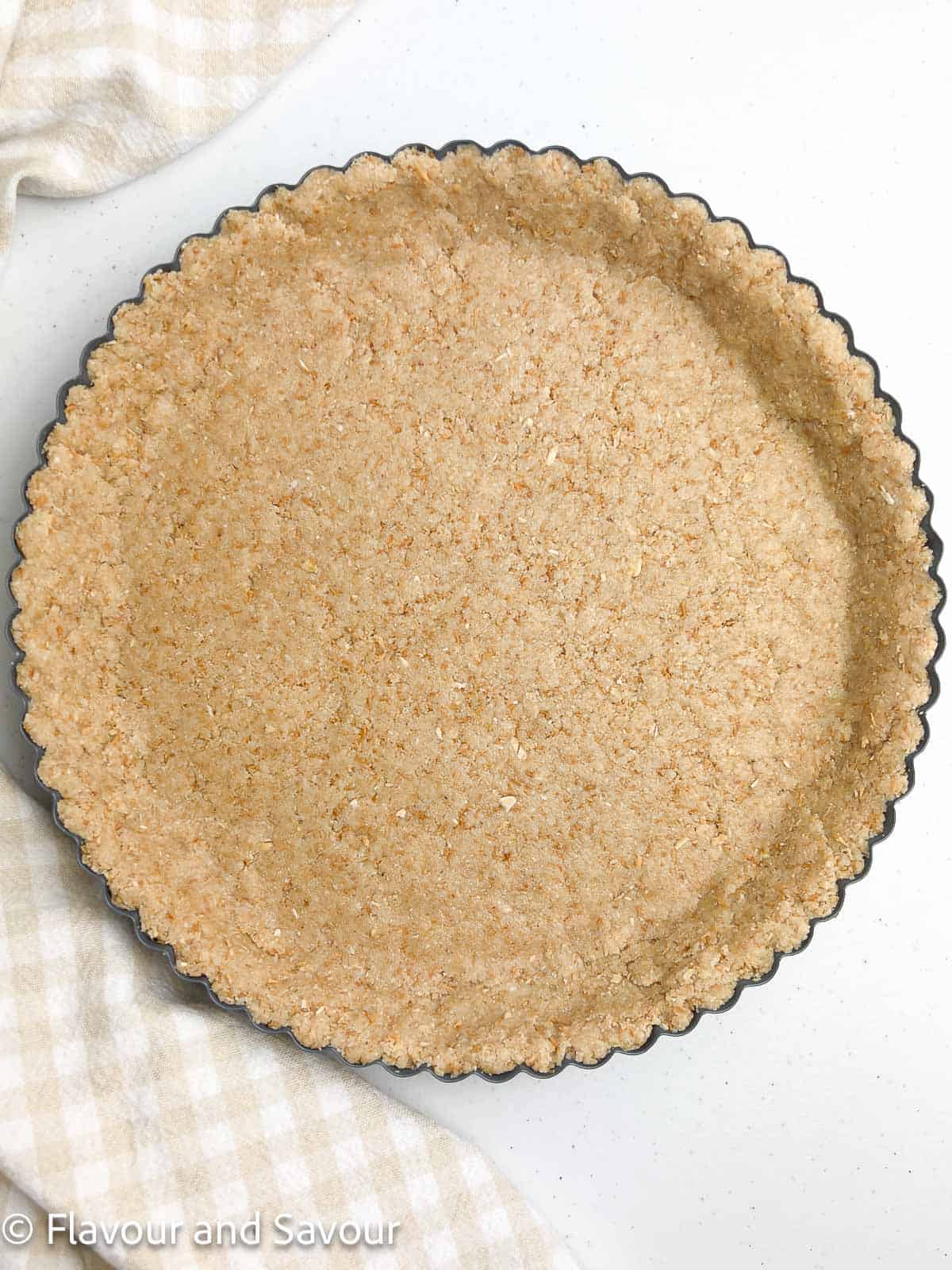 Almond flour crust in a tart pan.