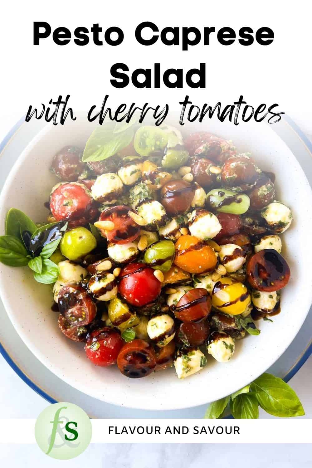 Image with text overlay for Pesto Caprese Salad with cherry tomatoes.