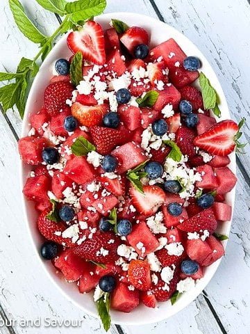 Strawberry watermelon salad with feta cheese and optional blueberries.