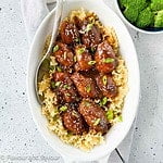 Slow Cooker Sticky Chicken Thighs cooked in a crock pot and served over noodles.