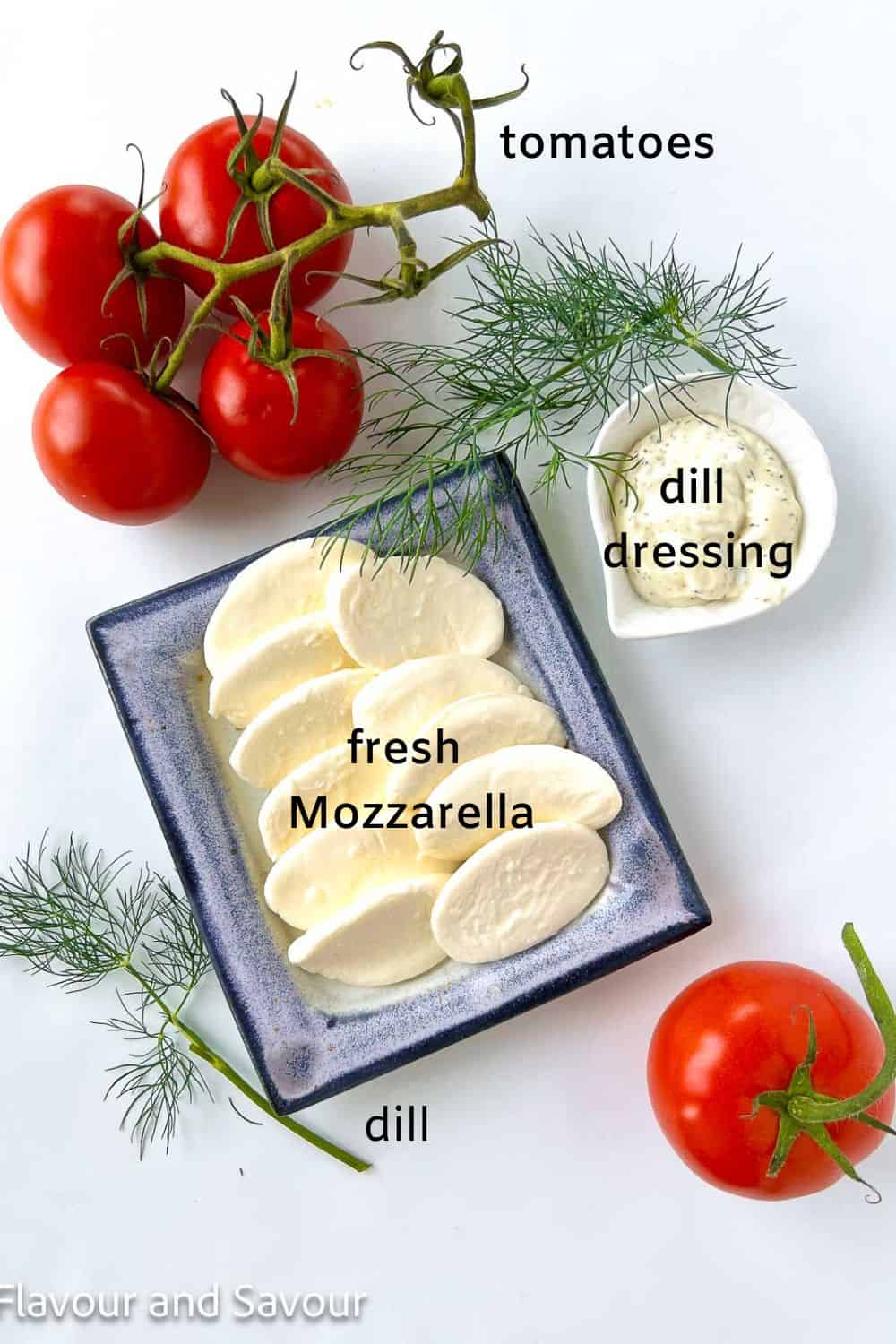 Labelled ingredients for Dill Caprese Salad: tomatoes, dill dressing, and bocconcini medallions.
